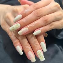 Long pale green nails with delicate floral details