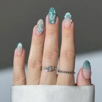 Long teal glitter nail extensions