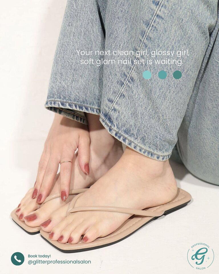 Client showing a matching glossy manicure and pedicure by Glitter Professional Salon